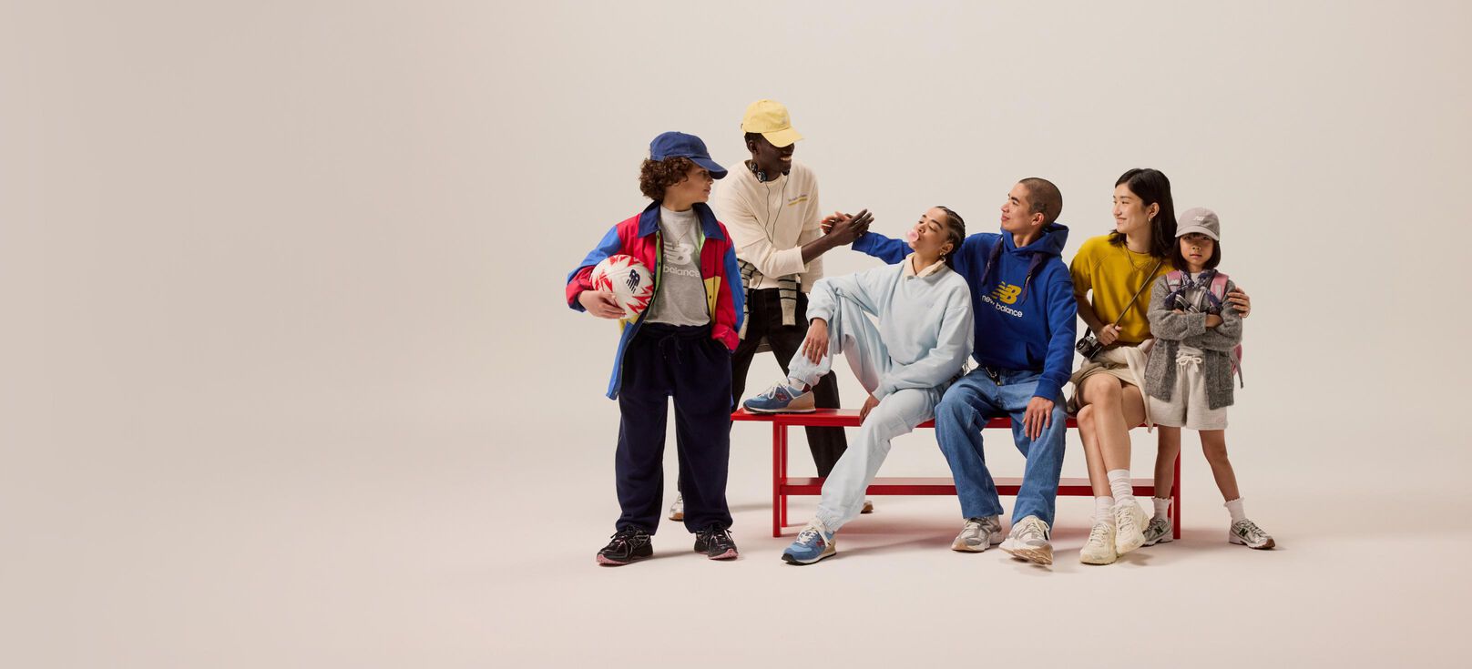 A  knee down shot image of an individual wearing a pair of New Balance 1000 sneakers 